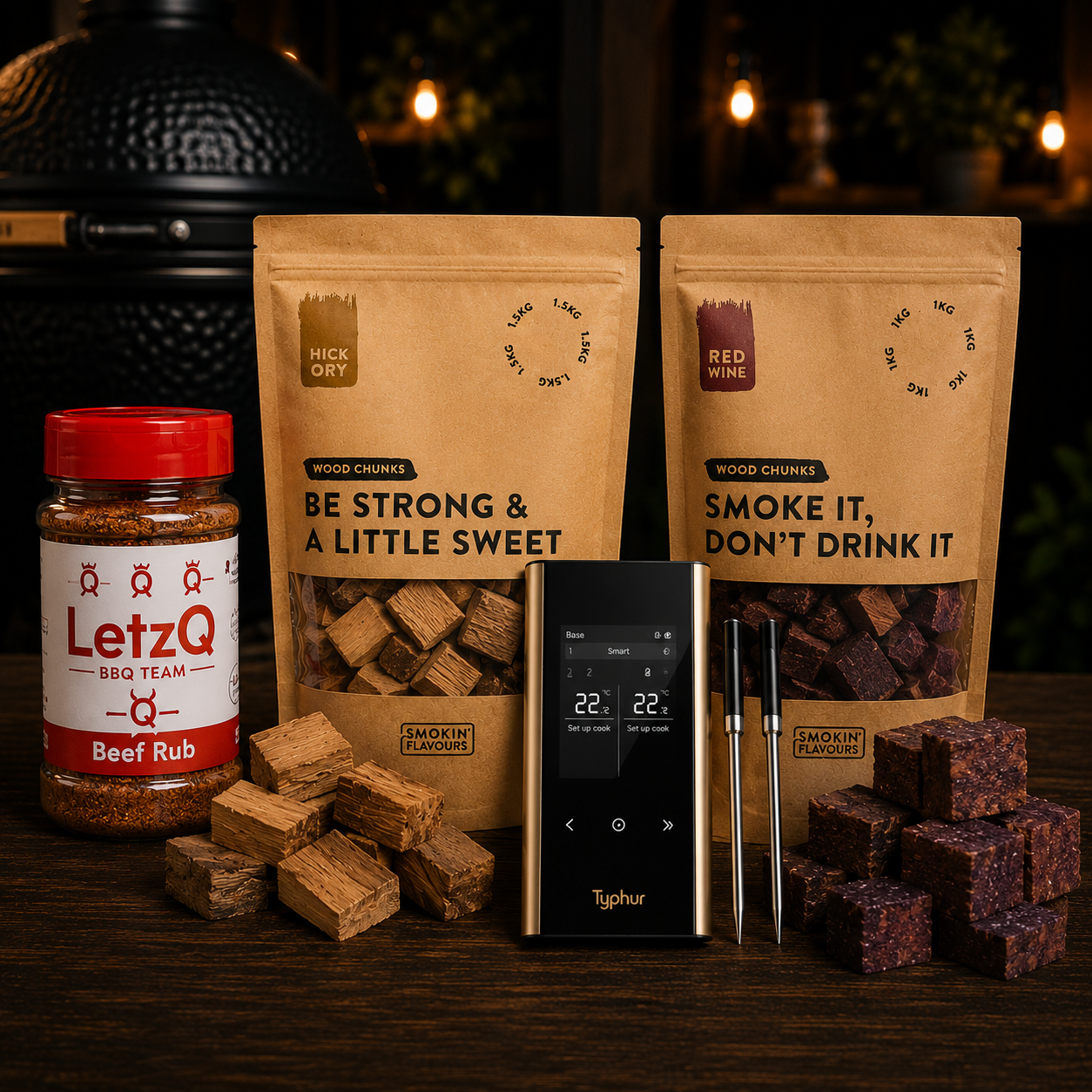 Ultimate Picanha Experience Bundle met Typhur Sync Gold Dual, LetzQ Beef Rub, Smokin' Flavours Hickory Chunks en Red Wine Chunks.